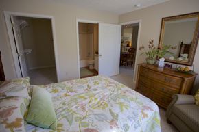 Avon Lake apartment for rent - a bedroom with a bed and a dresser and a bathroom
