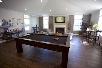 Sheffield Lake apartment for rent - an open living room with a pool table and a fireplace