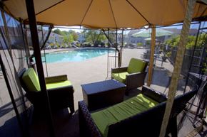 Sheffield Lake apartment for rent - a gazebo with chairs and a table next to a pool