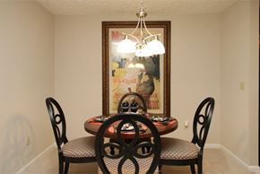 Cuyahoga Falls apartment for rent - a dining room with a table and chairs and a chandelier