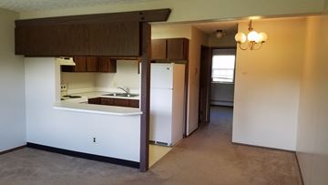 Stow apartment for rent - a view of a kitchen from the living room with the door open