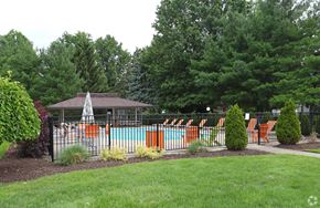 Stow apartment for rent - a swimming pool with a fence and a gazebo