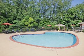 Kent apartment for rent - a resort style pool with trees in the background