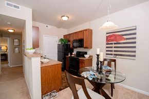 Gahanna apartment for rent - A kitchen with a table and chairs in the middle of the room.