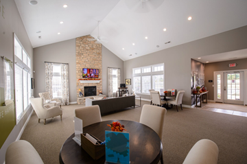 Westerville apartment for rent - A living room with a fireplace and a television on the wall.