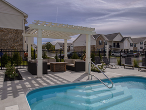 Westerville apartment for rent - A pool with a white pergola over it.