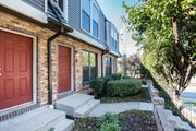 Kansas City townhouse for rent - the front of a brick house with two red doors