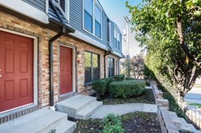 Kansas City townhouse for rent - the front of a brick house with two red doors