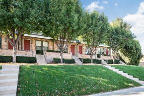 Kansas City townhouse for rent - a row of houses with trees in front of them