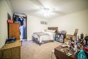 Kansas City townhouse for rent - a bedroom with a desk and a bed in it