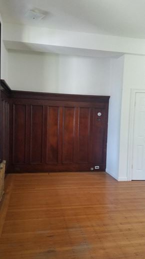 Philadelphia apartment for rent - an empty living room with wooden floors and a wooden door