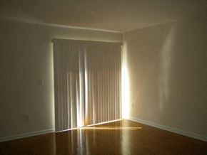 Jacksonville house for rent - A room with a light shining through a closed door.