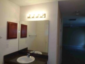 Jacksonville house for rent - A bathroom with a sink and mirror.