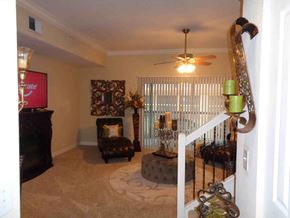Jacksonville house for rent - A living room with a chair, a table, and a fireplace.