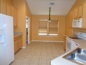 Orange Park house for rent - a large kitchen with a stove and a sink