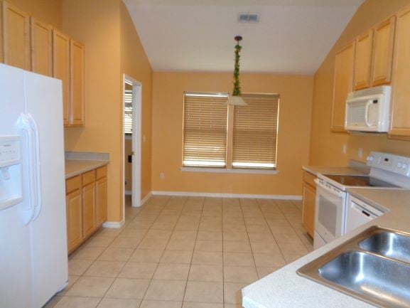 Orange Park house for rent - a large kitchen with a stove and a sink