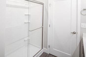 Baseline 158 - walk-in shower with glass enclosure in select units