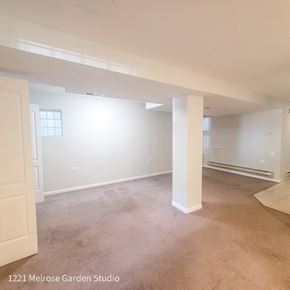 Chicago apartment for rent - an empty living room with white walls and a concrete floor