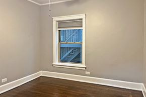 Oak Park apartment for rent - A room with a window showing a view of a building outside.