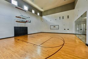 The Woodlands apartment for rent - the gym has a hardwood floor and a basketball court