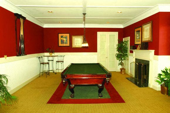 Frederick apartment for rent - a red living room with a pool table