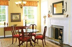 Frederick apartment for rent - a dining room with a table and chairs and a fireplace