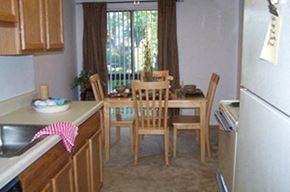 Frederick apartment for rent - a kitchen with a dining table and chairs