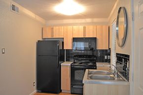 Austin apartment for rent - kitchen with brown cabinets