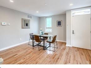Philadelphia house for rent - a dining room with a wooden floor and a table and chairs