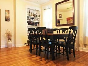 Philadelphia house for rent - A dining room with a wooden table and chairs.