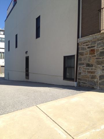 Philadelphia apartment for rent - A white building with a stone pillar on the side.