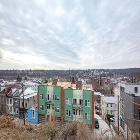 Philadelphia house for rent - A row of houses with different colored exteriors.