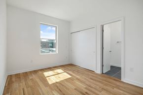 Philadelphia apartment for rent - an empty living room with a window and a door to a closet