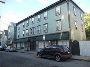 Newport apartment for rent - a car parked in front of a building on a street