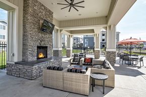 Colorado Springs apartment for rent - Covered Lounge with Cozy Fireplace by Pool at El Paso County Apartments Near I-25