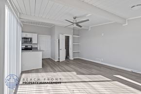Redondo Beach apartment for rent - A spacious room with a ceiling fan and a rug on the floor.
