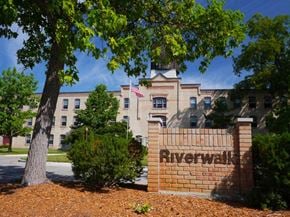 Grand Ledge townhouse for rent - the riverwalk sign in front of a building