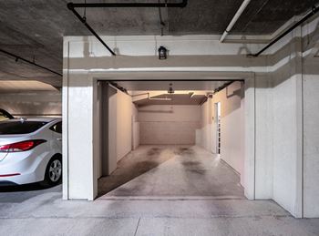 Underground parking garage with covered parking spaces