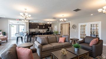 Delaware apartment for rent - a living room with couches and chairs and a kitchen