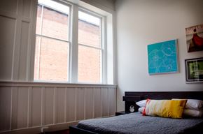 Danville apartment for rent - a bedroom with a bed and two large windows