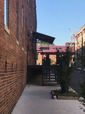 Danville apartment for rent - an alleyway between two brick buildings with a gate