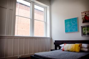 Danville apartment for rent - a bedroom with a bed and two large windows