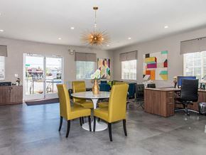 Sparks apartment for rent - a dining room with yellow chairs and a table
