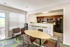 Nashville apartment for rent - a dining room with a table and chairs and a kitchen