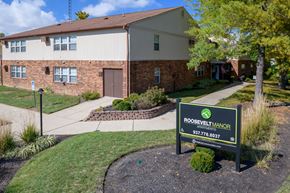 Piqua apartment for rent - an apartment building with a sign in front of it
