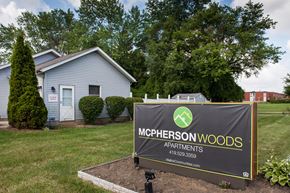 Mansfield apartment for rent - a mcpherson woods apartments sign in front of a house
