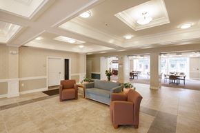 North Olmsted apartment for rent - a lobby with couches and chairs and a table in the background