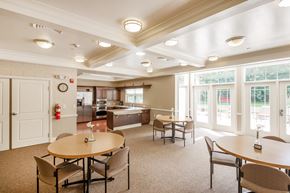 North Olmsted apartment for rent - a community room with tables and chairs and a kitchen