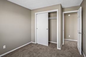 Dayton apartment for rent - an empty bedroom with a closet and a door open