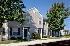 Lima apartment for rent - a gray house with trees in front of it
